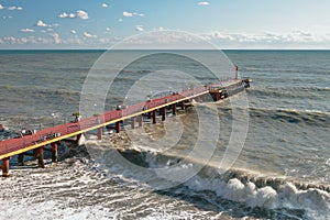 Pier and sea waves. Adler, Sochi, Russia