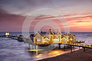 Pier in Sellin at purple sunrise, Germany