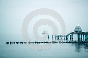 Pier with the ship on the horizon in Sellin, Germany