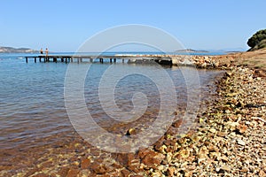 Pier on shores of  Aegean Sea