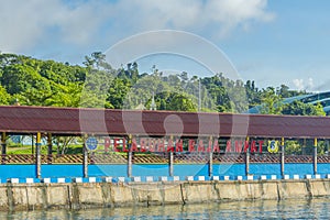 The pier with the signn Pelabuhan - harbor- Raja Ampat of Waisai at Raja Ampat islands photo
