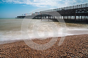 A pier and stony beach in Hastings