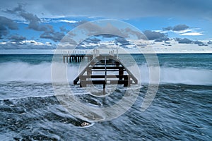 Pier in the stormy sea