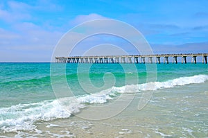 Pier stretching out over Gulf of Mexico waters