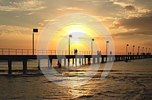 Pier,sunset and silhouettes,
