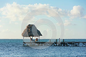 Pier with Thatched Cabana on Caribbean beach