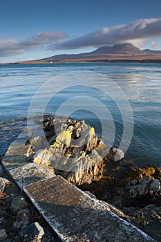 Pier to water's edge, overlooking the mountains of Jura