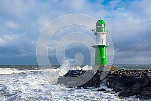 Pier tower on shore of the Baltic Sea during the storm Eunice in Warnemuende, Germany