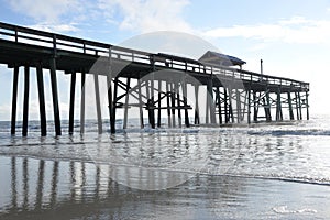 A pier is traditionally a gathering place for sportsmen to meet and have fun fishing for hours on-end. photo