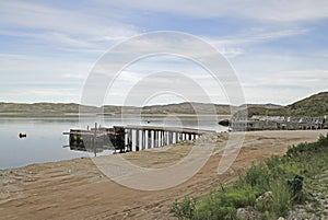 Pier and water line in village Teriberka