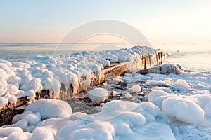 Pier in the winter sea. ice, overcast, nature background