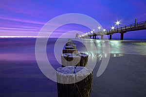 Pier in Zingst in a long exposure at blue hour. In addition the wonderful colors of the night sky