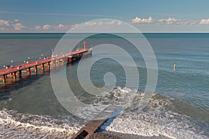 Pierce, breakwater and sea after last night`s storm. Adler, Sochi, Russia