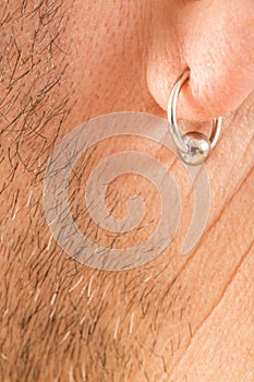 Pierced ear of a man