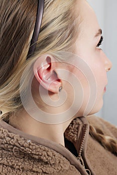 piercings on an ear. Conch and helix piercings close up.