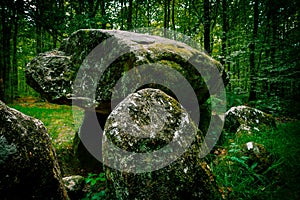 The Pierre CourcoulÃ©e a dolmen found in the forest of FougÃ¨res in Brittany