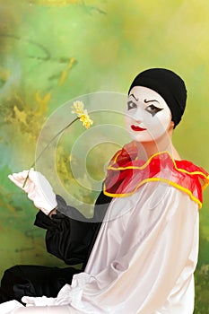 Pierrot clown with flower