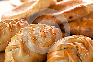 Pies on the background of the abundance of bakery products