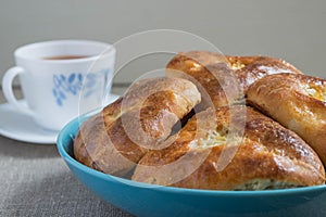 Pies with cabbage and tea