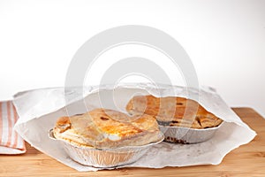 Pies served in white paper bag