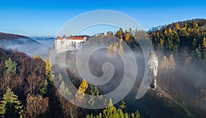 Pieskowa Skala cliff with Hercules cudgel rock and castle near Krakow, Poland