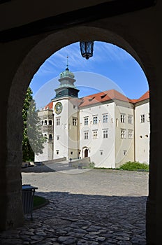 The Pieskowa Skala Royal Castle seen through the entrance gate, Suloszowa village, Poland.