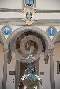 Pietro Tacca bronze fountain, sculptor, and Hospital of the Innocents. Square of the Santissima Annunziata in Florence