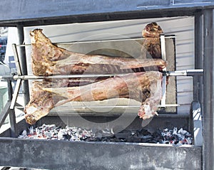 Pig carcass on a spit. grill.