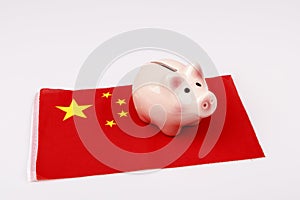 Pig money box and China flag