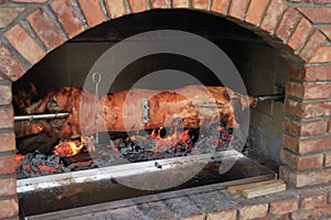Pig roasting on a spit