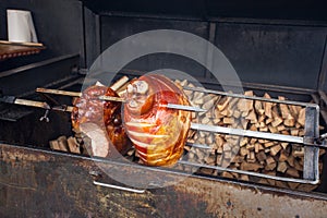 The pig`s leg on the grill, roast, Prague