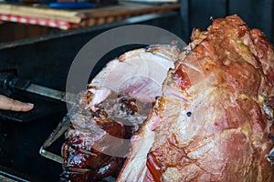 The pig`s leg on the grill, roast, Prague