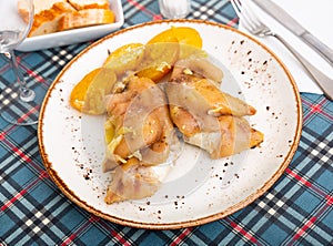 Pig's trotter served on white plate