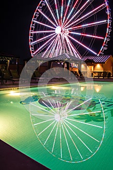 Pigeon Forge, Tennessee - December 3, 2017 : Reflection of the Great Smoky Mountain Wheel in the pool of The Island