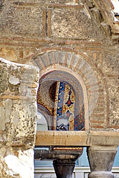 Pigeon in front of the gold mosaic on Panagia Kapnikarea church