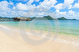 Pigeon Island Beach - tropical coast on the Caribbean island of St. Lucia. It is a paradise destination with a white sand beach
