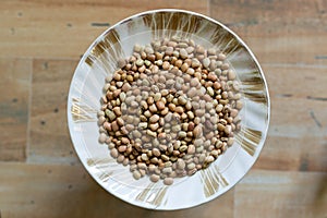 Pigeon pea or red gram on a side dish plate wooden blur background