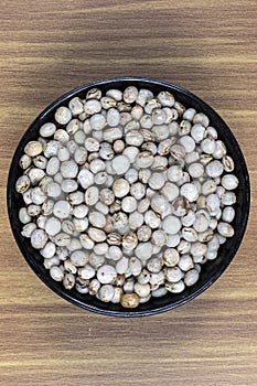 Pigeon pea or tuvar beans or guandu bean Cajanus cajan seeds in ceramic bow