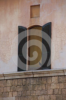 A pigeon perched in an open window