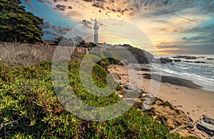 Pigeon Point lighthouse against the backdrop of a beautiful sky and ocean with waves, a great landscape of the Pacific coast in