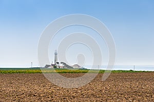 Pigeon point lighthouse on a cliff edge. California Highway 1. Coast of California, Big Sur. Agriculture