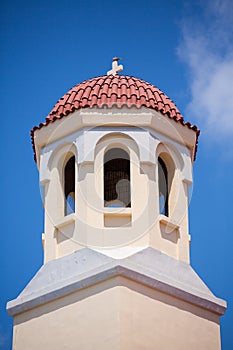 Pigeon resting on a roof of an orthodox church in Rethimnon photo