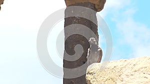 A pigeon stands on a stone in a medieval fortress