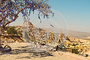 Pigeon Valley in Cappadocia and tree with nazar amulets photo