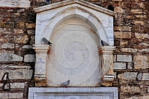 Pigeons on Facade of Ancient Greek Orthodox Church, Athens, Greece