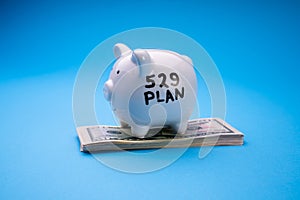 Piggy Bank And 529 Number Showing College Saving Plan