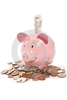 Piggy bank with British currency money