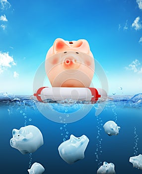 Piggy bank with buoy floating on water