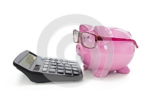 Piggy bank and calculator concept for saving, accounting, banking and business account
