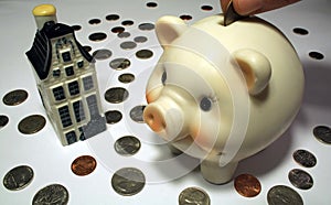 Piggy Bank, Coins, and Model Home